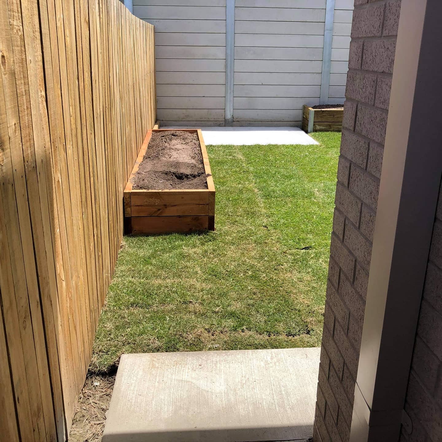 Ripley full house landscaping with retaining, turfing, concrete paths and shed slabs