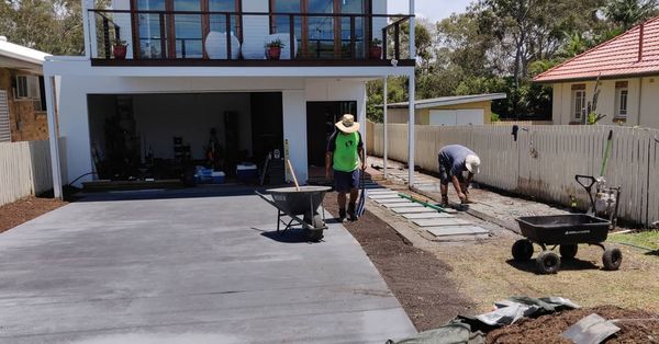 Landscaping in Lota - Paving, concrete driveway, gardens and feature fence