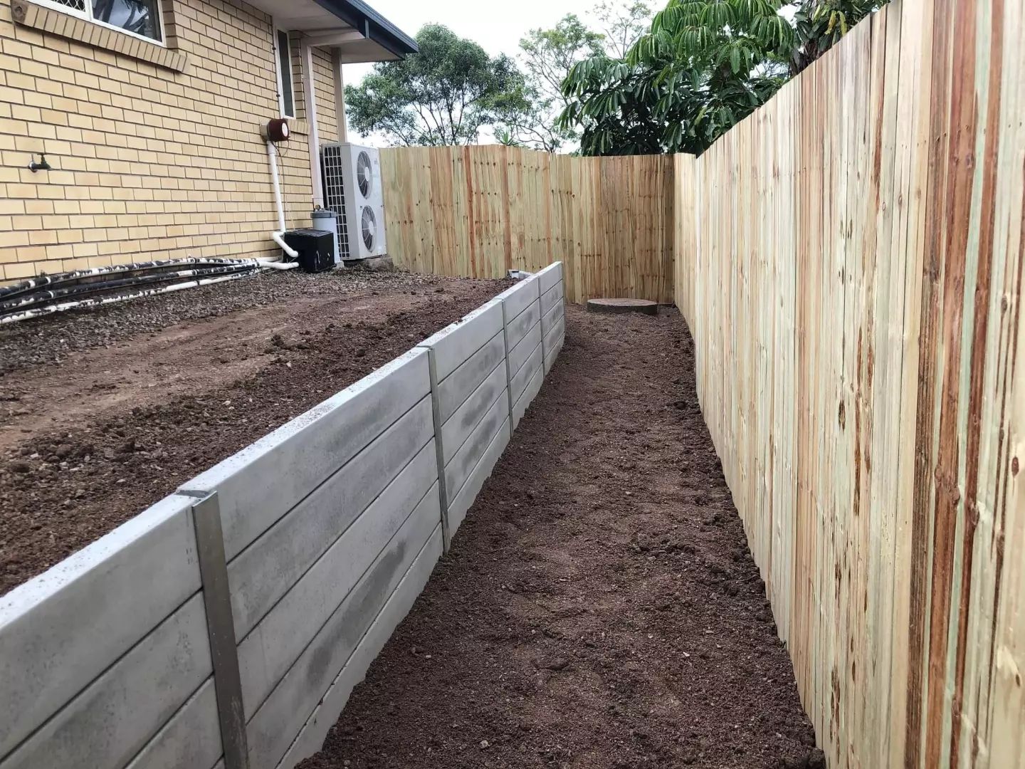50m of concrete sleeper retaining walls installed with drainage systems 05