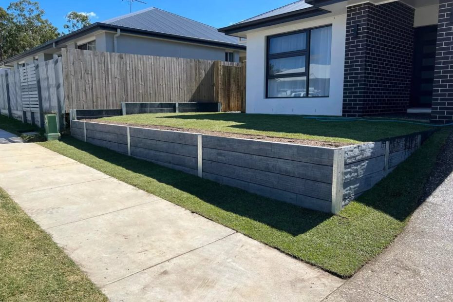 Sandstone block retaining wall Approx 30m of sandstone block concrete sleeper retaining wall 1m high