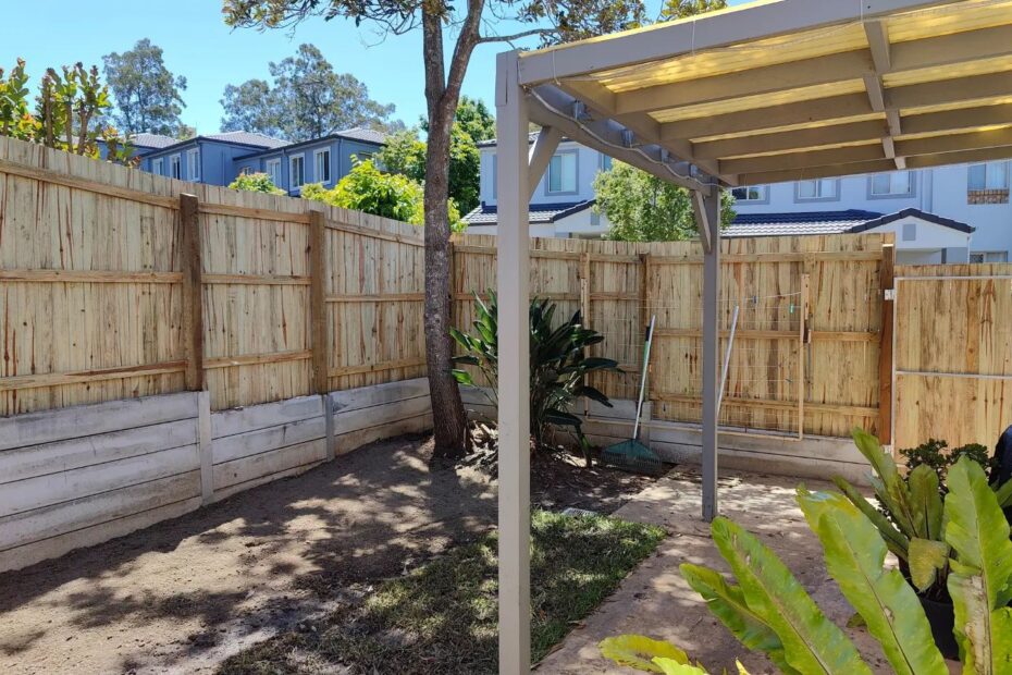 Small boundary concrete retaining wall and timber fence - Part 2