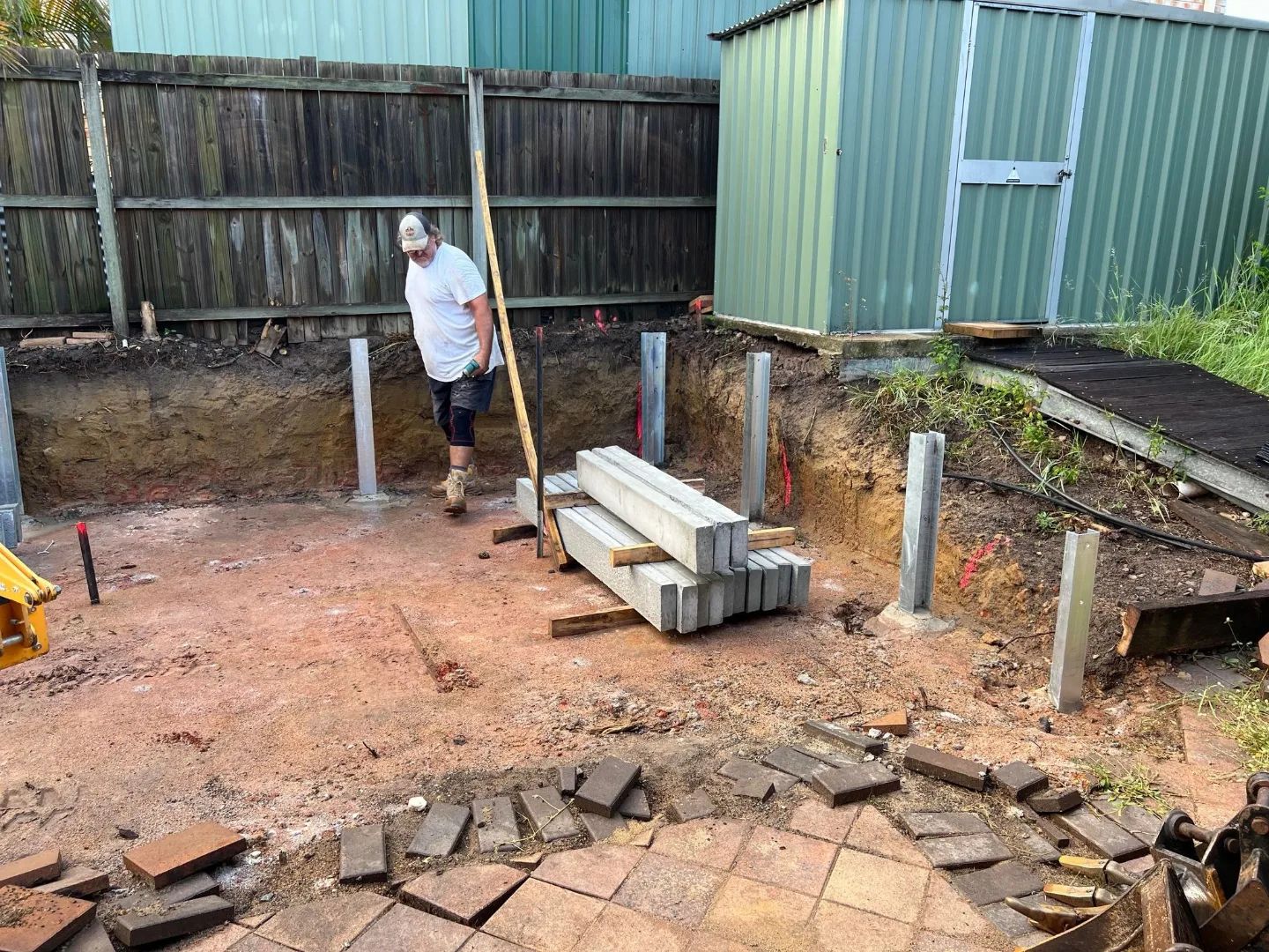 Large dig-out, concrete retaining wall and colourbond fencing