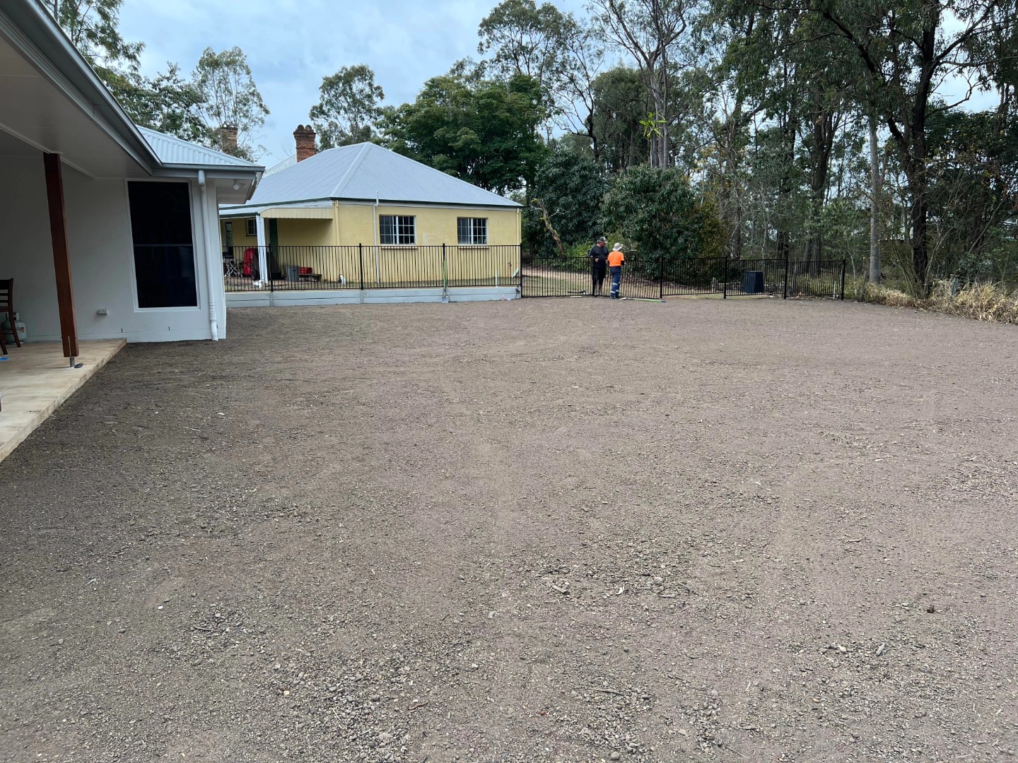 With the hard work behind us, it's time to witness the true transformation. Freshly laid turf adds a lush and inviting carpet to the newly leveled yard.