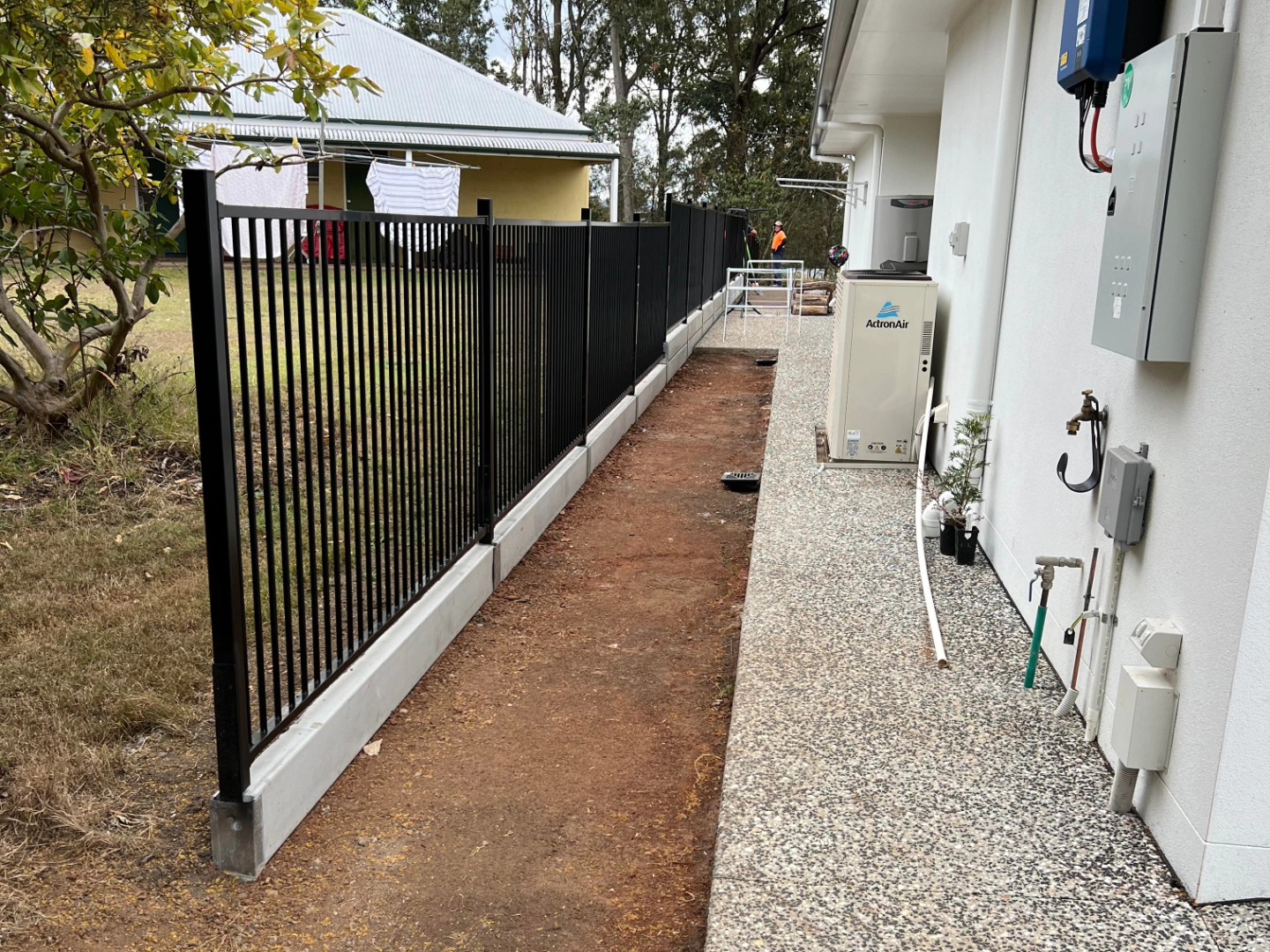 04 Turf preparation at its finest with the addition of a boundary concrete sleeper retaining wall and aluminum tubular fence